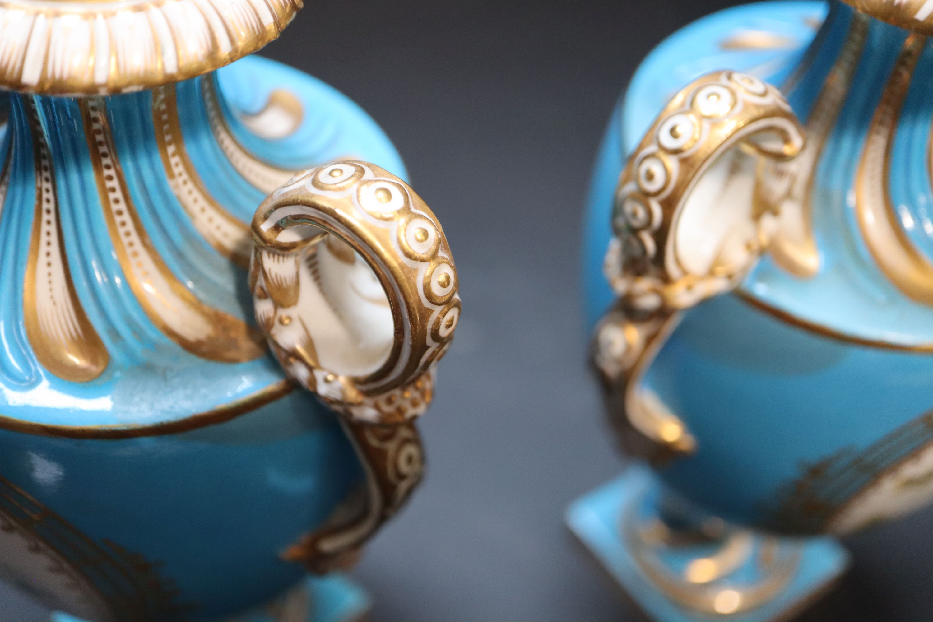 A pair of mid 19th century Coalport turquoise ground two handled vases, height 21cm.